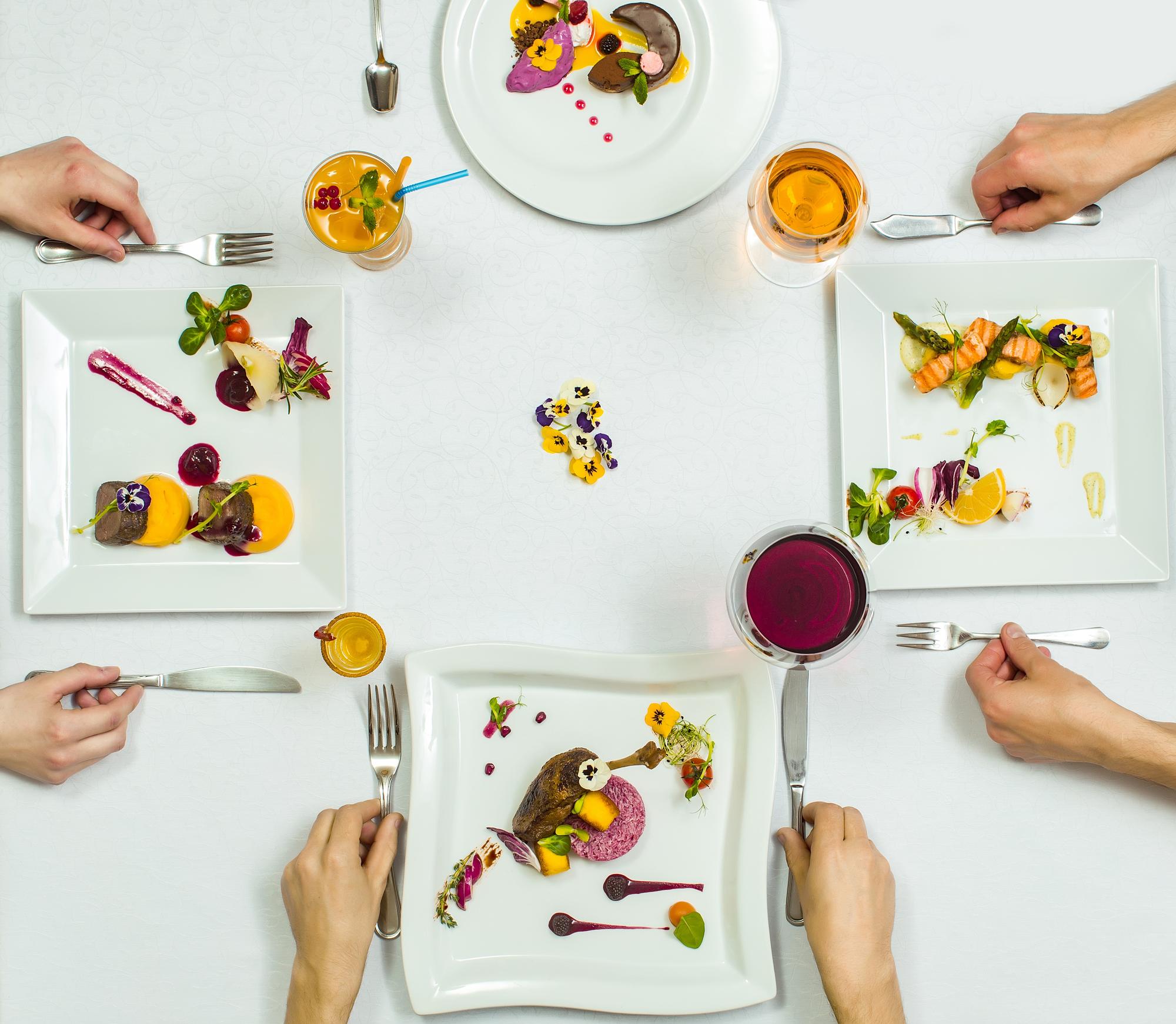Workshop participants plating a dish together