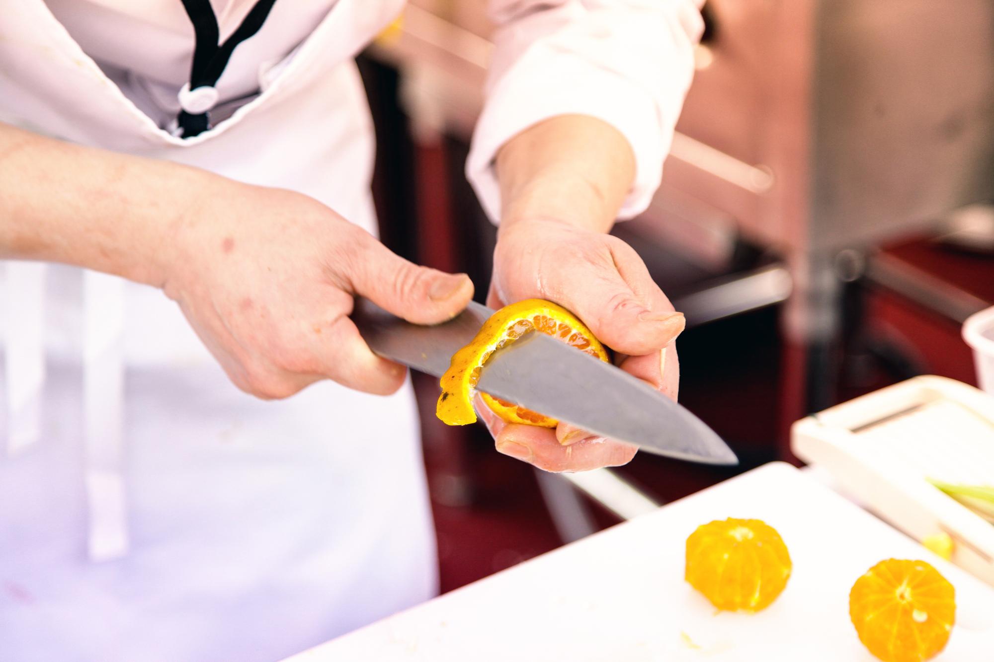 Instructor teaching knife skills